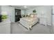 A cozy bedroom with a comfortable bed, soft carpet, and a mirror sliding closet at 13166 Huerta St, Venice, FL 34293