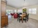 Open concept dining room with tile floors, natural light, and views of the pool area at 13166 Huerta St, Venice, FL 34293