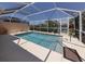 Inviting in-ground pool within a screened enclosure, providing a private outdoor retreat at 13166 Huerta St, Venice, FL 34293
