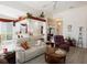 Inviting living room with comfortable seating, open layout, and access to the kitchen at 13415 Coluccio St, Venice, FL 34293