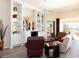 Bright living room with stylish decor, including mirrored shelving and comfortable seating at 13415 Coluccio St, Venice, FL 34293