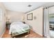 Bright bedroom featuring a comfortable bed and a decorative 'be our guest' wall decor at 140 Avenida De La Isla, Nokomis, FL 34275