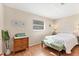 Bright bedroom featuring a comfortable bed and a beach-themed decor at 140 Avenida De La Isla, Nokomis, FL 34275