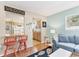 Bright living room with breakfast bar offering a view into the kitchen area at 140 Avenida De La Isla, Nokomis, FL 34275