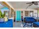 Inviting screened porch with comfortable seating, ceiling fan, and stylish decor at 140 Avenida De La Isla, Nokomis, FL 34275