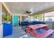 Inviting screened porch with comfortable seating, ceiling fan, and stylish decor at 140 Avenida De La Isla, Nokomis, FL 34275