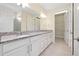 Bright bathroom features double sinks, granite countertops, and ample cabinet space for storage at 1565 Hyssop Loop, North Port, FL 34289