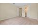 Bright carpeted bedroom leading to bathroom and closet with plenty of space and natural light at 1565 Hyssop Loop, North Port, FL 34289