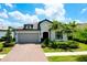 Charming single-Gathering home featuring a two-car garage and beautiful landscaping at 1565 Hyssop Loop, North Port, FL 34289