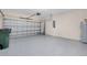 Spacious two car garage with epoxy flooring and water heater at 1565 Hyssop Loop, North Port, FL 34289