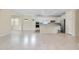 Modern kitchen with stainless steel appliances, island, recessed lighting and tiled floors at 1565 Hyssop Loop, North Port, FL 34289