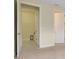 Open doorway showcasing the laundry room with tile floors and convenient storage options at 1565 Hyssop Loop, North Port, FL 34289