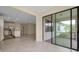 View of the living room leading into an open floor plan with a dining area and modern kitchen at 1565 Hyssop Loop, North Port, FL 34289