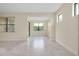Open living room featuring tile floors, windows and neutral paint at 1565 Hyssop Loop, North Port, FL 34289