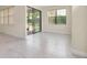 Bright room features tile floors, sliding glass doors to the lanai, and a large window with pleasant views at 1565 Hyssop Loop, North Port, FL 34289