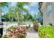 The community pool has lots of seating, shaded areas, and pretty landscaping at 1565 Hyssop Loop, North Port, FL 34289
