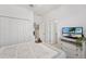 The bedroom has a TV, closet, dresser, and an attached bathroom at 1608 Saddlewood Cir, Port Charlotte, FL 33953