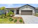 Charming single-story home with a well-maintained front yard and a stone-accented entrance at 1608 Saddlewood Cir, Port Charlotte, FL 33953