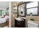 Bathroom featuring tile floors, updated fixtures and vanity, and bright natural light at 1609 Kirkwood St, North Port, FL 34288