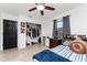 Bedroom featuring bed, tile floors, ceiling fan, closet and natural light at 1609 Kirkwood St, North Port, FL 34288