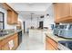 Modern kitchen showcases light-colored countertops, black appliances, and seamless integration into dining area at 1609 Kirkwood St, North Port, FL 34288