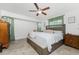 Spacious main bedroom with bench seat and modern decor, tile floors, and lots of natural light at 1609 Kirkwood St, North Port, FL 34288