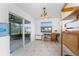 Bright office features sliding glass doors to the patio, a practical desk, and built-in storage at 1609 Kirkwood St, North Port, FL 34288