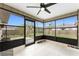 Enclosed sunroom features bright lighting, neutral tile flooring, and an unobstructed view of the backyard at 1609 Kirkwood St, North Port, FL 34288