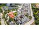 Aerial view of a meticulously designed neighborhood with lush landscaping and a central community pool at 1711 Gondola Park Dr # 1711, Venice, FL 34292
