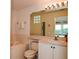 Well-maintained bathroom featuring a soaking tub, neutral tile, and vanity with ample storage space at 1711 Gondola Park Dr # 1711, Venice, FL 34292