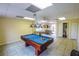 Billiard room with pool table, and tile flooring, offering a recreational space for residents at 1711 Gondola Park Dr # 1711, Venice, FL 34292