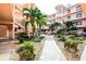 Well maintained courtyard with verdant landscaping and a central walkway at 1711 Gondola Park Dr # 1711, Venice, FL 34292