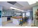 Bright craft room with ample counter space, stools, and natural light, perfect for hobbies and creative projects at 1711 Gondola Park Dr # 1711, Venice, FL 34292