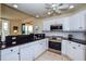 Modern kitchen boasts granite countertops, stainless steel appliances, and ample cabinet space at 1711 Gondola Park Dr # 1711, Venice, FL 34292