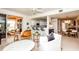 Spacious living room featuring a sliding glass door to the balcony and views of the dining and kitchen areas at 1711 Gondola Park Dr # 1711, Venice, FL 34292
