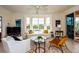 Bright living room features large windows, comfortable seating, and a view of the balcony at 1711 Gondola Park Dr # 1711, Venice, FL 34292
