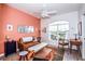 Bright living room featuring a stylish leather sofa, white bench, modern decor, and an abundance of natural light at 1711 Gondola Park Dr # 1711, Venice, FL 34292