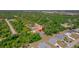 Lovely home surrounded by lush trees, offering a serene setting in a suburban neighborhood at 172 Berthoud St, Port Charlotte, FL 33953