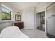 Spa-like bathroom with a soaking tub, and a separate shower with a tiled accent wall at 172 Berthoud St, Port Charlotte, FL 33953