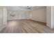 Spacious bedroom with a ceiling fan, ample closet space, large windows, and beautiful wood laminate flooring at 172 Berthoud St, Port Charlotte, FL 33953