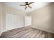 Bedroom with wood floors, a ceiling fan, large closet, and neutral paint at 172 Berthoud St, Port Charlotte, FL 33953