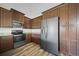 Modern kitchen with stainless steel appliances, granite countertops, and ample cabinet space at 172 Berthoud St, Port Charlotte, FL 33953