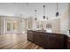 Modern kitchen featuring a center island, stainless steel appliances, and an open concept layout at 172 Berthoud St, Port Charlotte, FL 33953