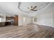Open-concept living space with wood flooring, recessed lighting, and a modern ceiling fan at 172 Berthoud St, Port Charlotte, FL 33953