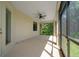 Screened patio with a ceiling fan and view of the backyard at 172 Berthoud St, Port Charlotte, FL 33953