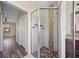 Modern glass shower with decorative stone tile and mounted shelves at 172 Berthoud St, Port Charlotte, FL 33953