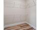 Spacious walk-in closet featuring wire shelving and wood grain flooring at 172 Berthoud St, Port Charlotte, FL 33953