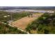 Large land featuring a home, pond, and boat, all framed by a white boundary line at 1727 E Manasota Beach Rd, Englewood, FL 34223