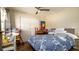 Bedroom featuring a large closet and a bed with blue-patterned comforter at 1727 E Manasota Beach Rd, Englewood, FL 34223