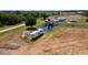 Spacious property with a home, pond, RV and boat, surrounded by lush greenery at 1727 E Manasota Beach Rd, Englewood, FL 34223